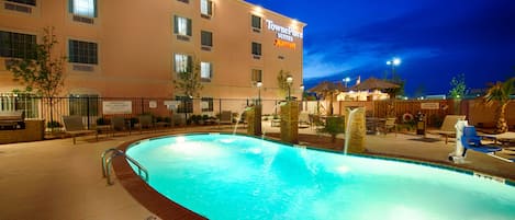 Outdoor pool, open 7:00 AM to 10:00 PM, pool umbrellas