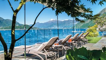 Private beach, black sand, sun-loungers, beach umbrellas