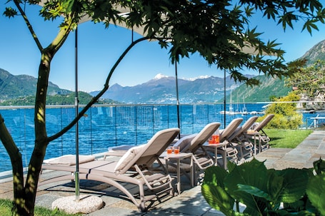 Private beach, black sand, sun loungers, beach umbrellas