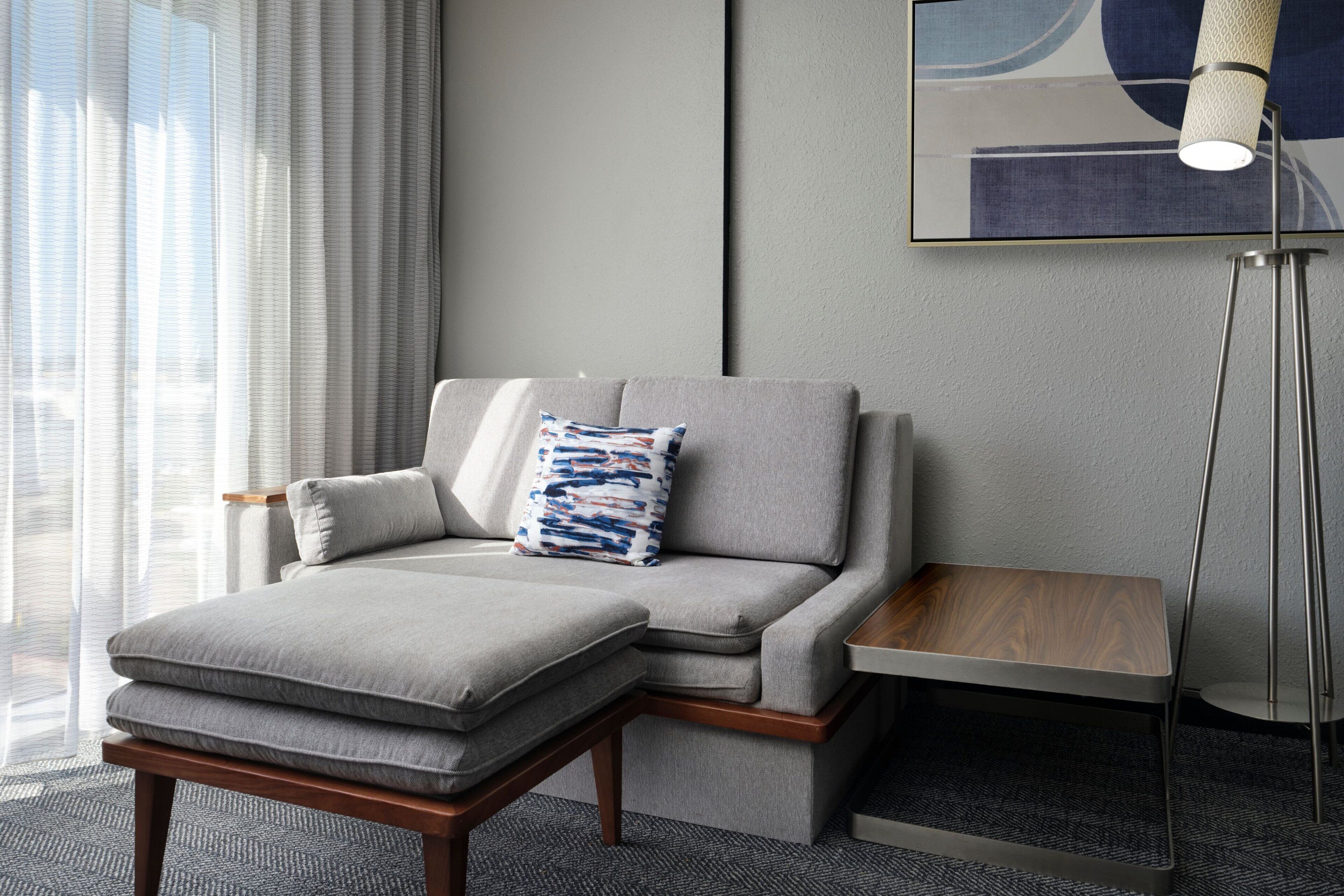 Hypo-allergenic bedding, desk, laptop workspace, blackout drapes