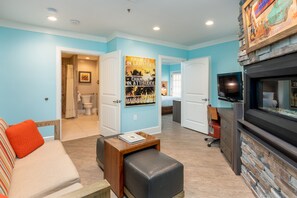 Suite, 1 King Bed with Sofa bed | Living room | 40-inch LCD TV with digital channels, TV, fireplace