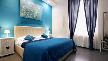 Deluxe Room | Minibar, in-room safe, blackout curtains, soundproofing