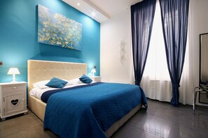 Chambre Deluxe | Minibar, coffres-forts dans les chambres, rideaux occultants