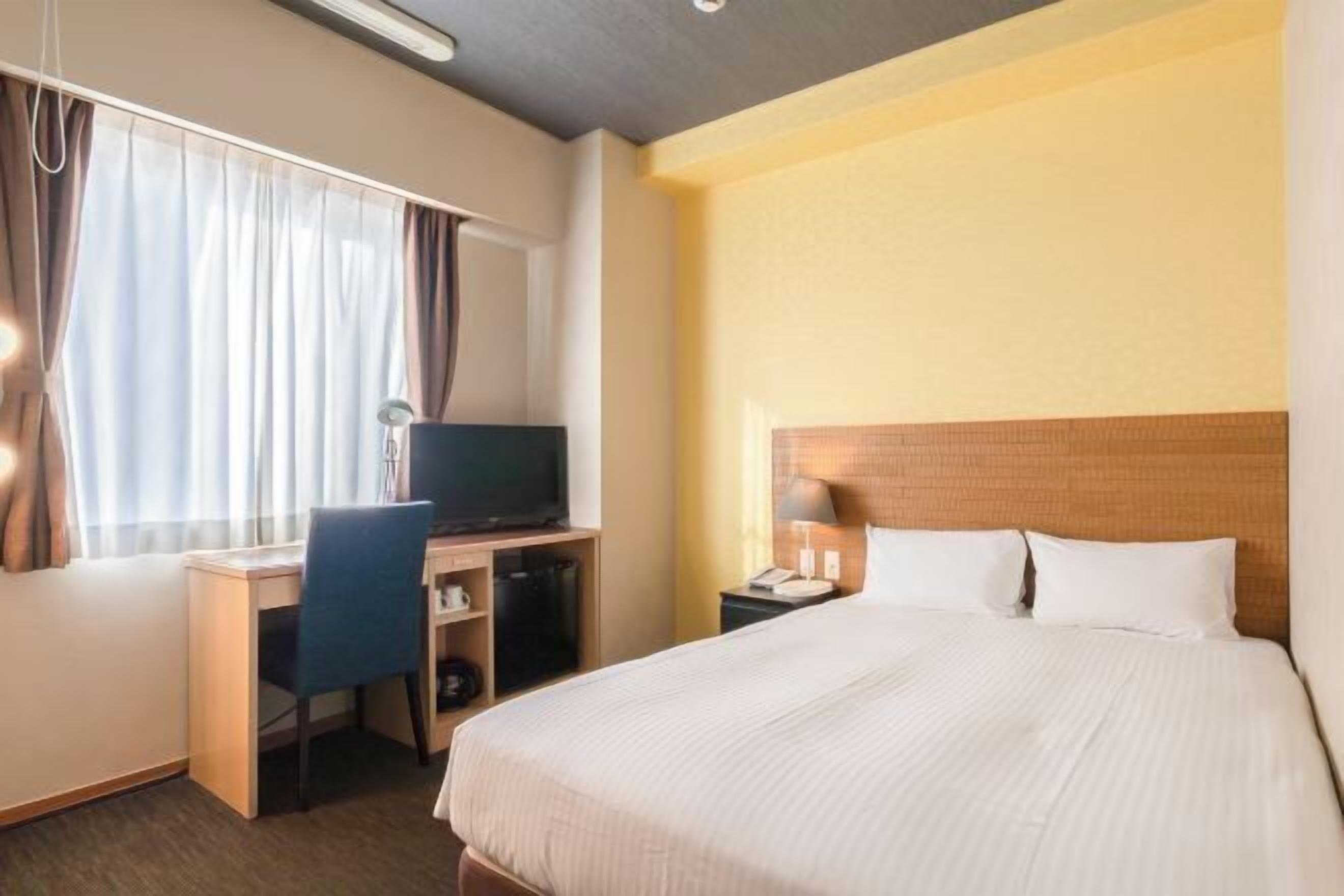 Desk, laptop workspace, blackout drapes, iron/ironing board