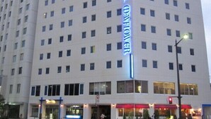 A multi-story hotel with a prominent 'Hotel Flower' sign. - Hotel Mayflower Sendai (Sendai)