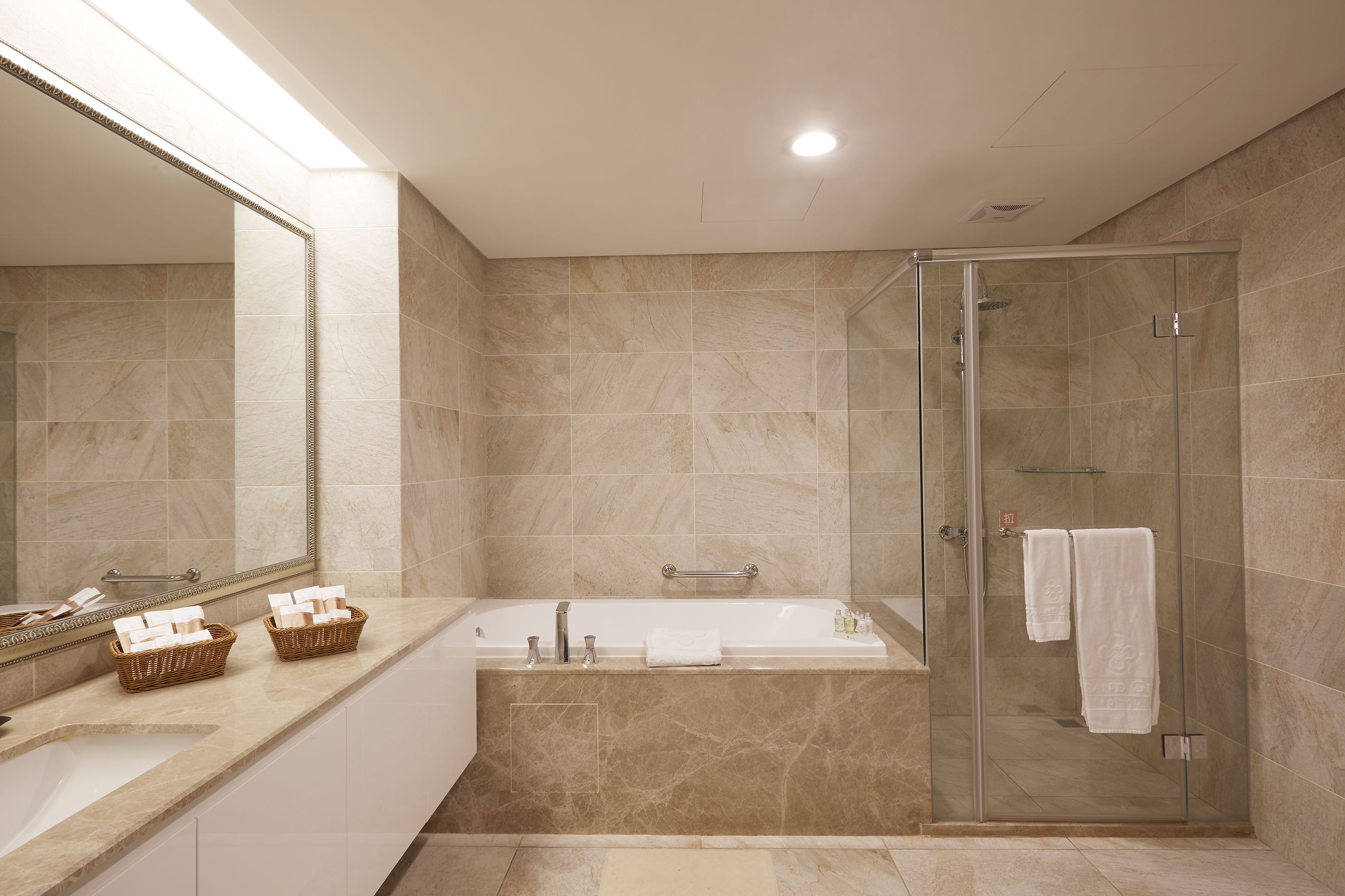 deluxe family room | bathroom | free toiletries, hair dryer, slippers, towels