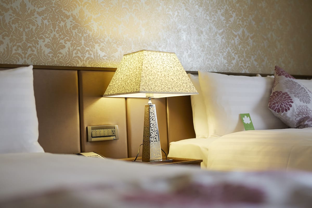 deluxe family room | down duvets, in-room safe, desk, blackout curtains