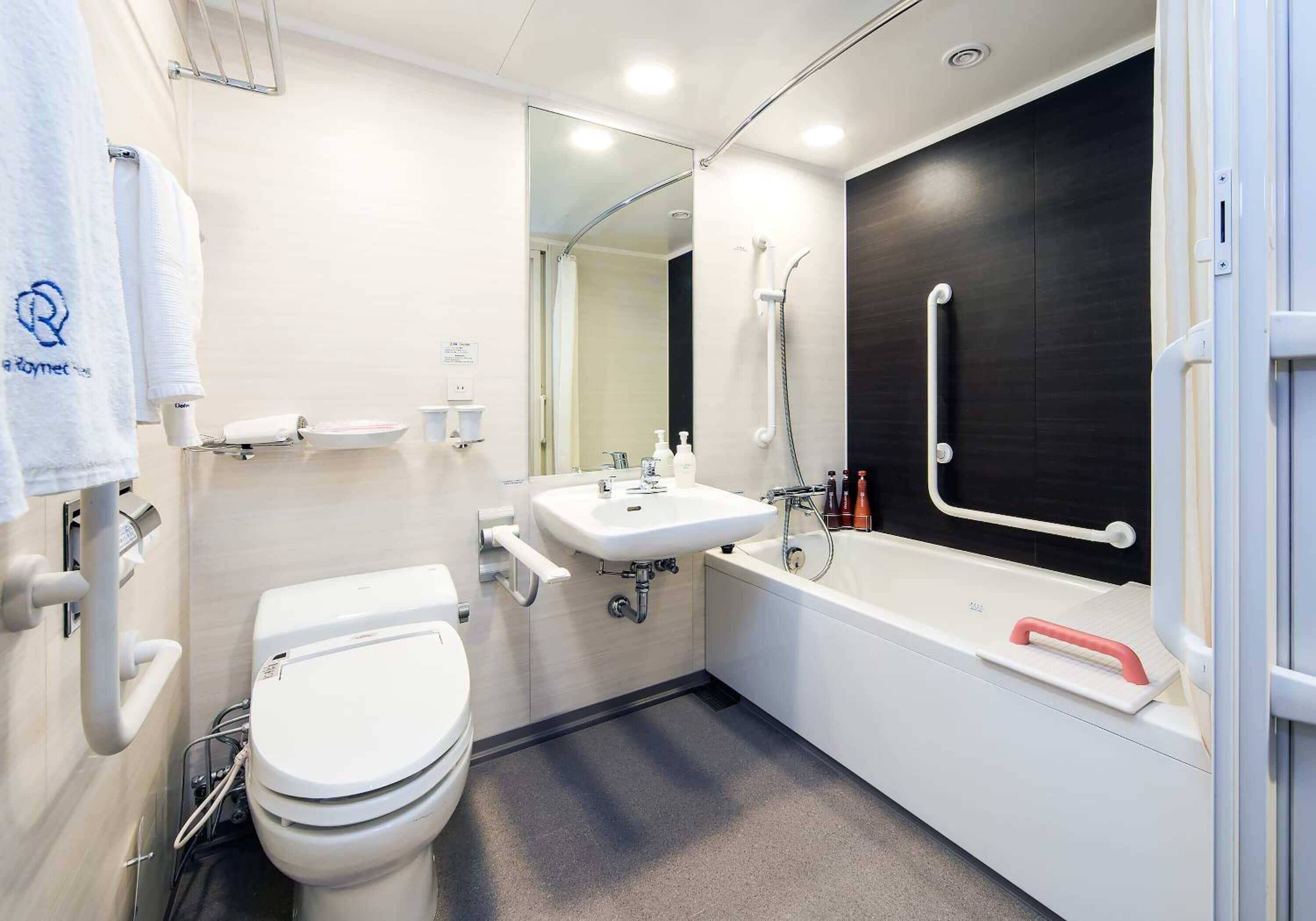 combined shower/bathtub, free toiletries, hair dryer, slippers