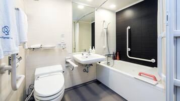 Combined shower/tub, free toiletries, hair dryer, slippers