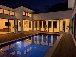 A modern house with a swimming pool, large windows, and a flat roof. - Sapphire Bay Fiji (Lautoka)