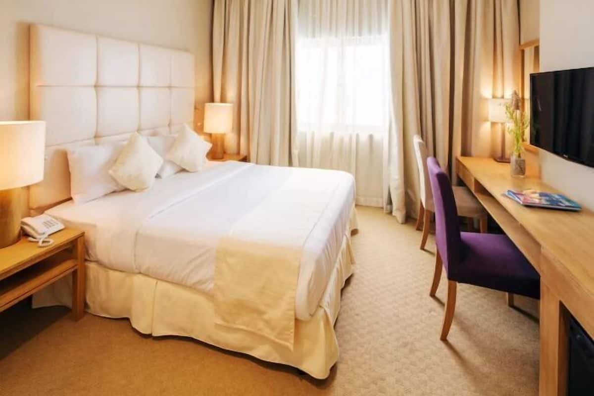 Lakens van Egyptisch katoen, pillowtop-bedden, een minibar