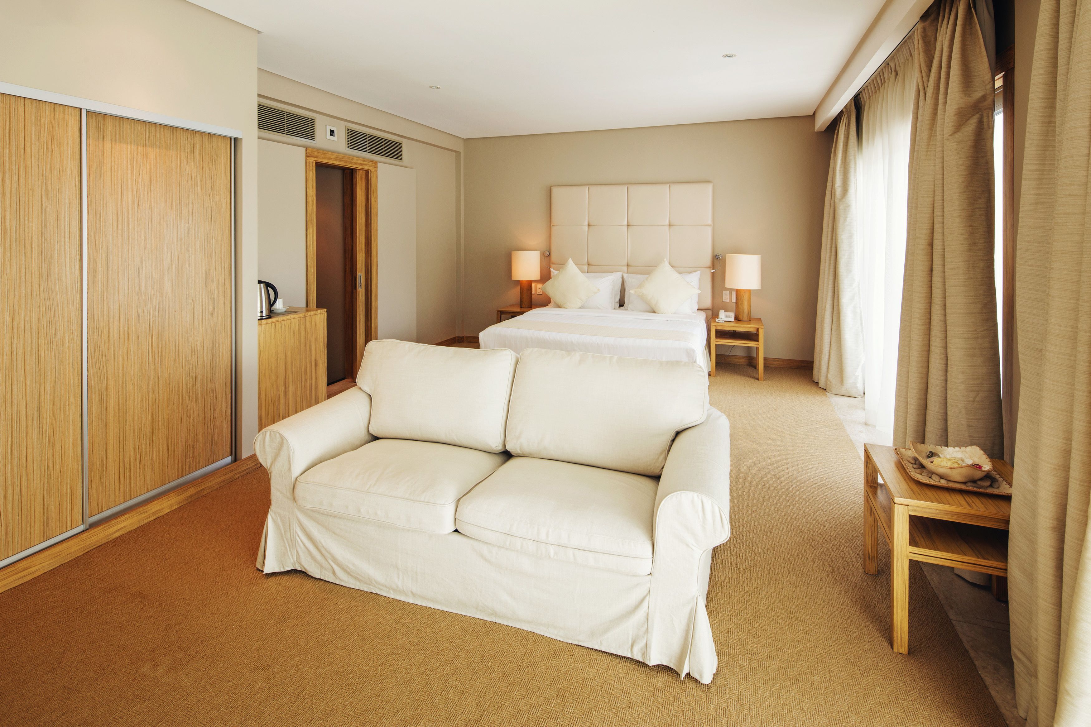 junior suite | living area | 40-inch lcd tv with digital channels, tv, ipod dock