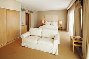 Junior Suite | Living area | 40-inch LCD TV with digital channels, TV, iPod dock