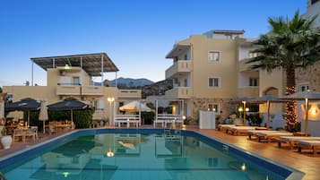 Seasonal outdoor pool, pool umbrellas, pool loungers
