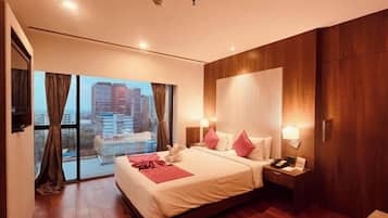 Premium bedding, down comforters, pillowtop beds, in-room safe