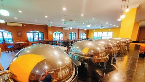 A buffet setup with multiple food stations covered by dome-shaped glass protectors. - Virgo Batik Resort Teluk Batik Lumut (Lumut)