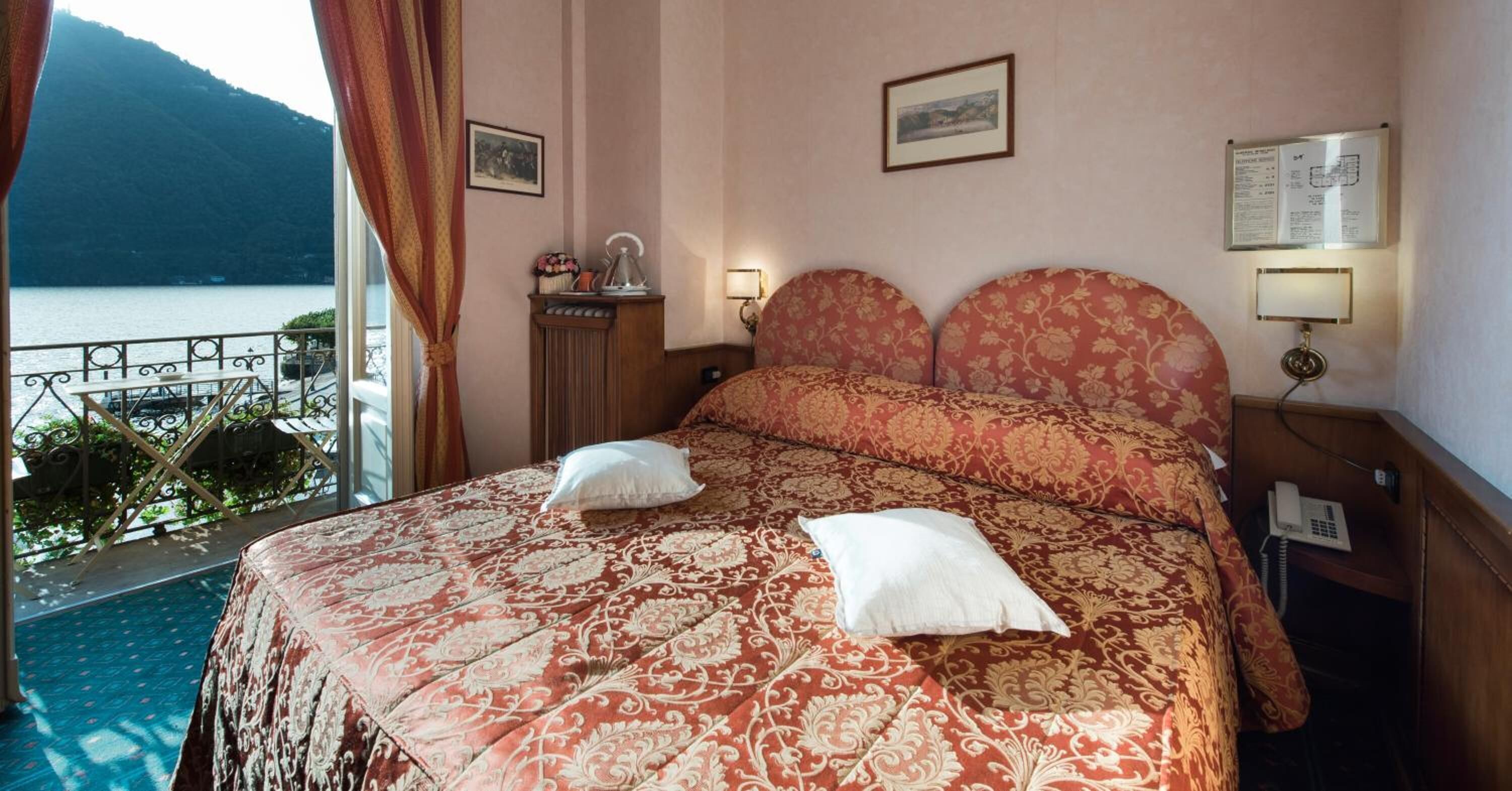 double room, balcony, lake view | minibar, in-room safe, desk, laptop workspace