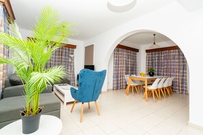 Villa, 4 Bedrooms, Partial Sea View | Living area | 43-inch flat-screen TV with satellite channels, TV - Kotsias Corallia Villas (Pegeia)