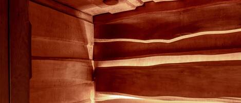 A wooden staircase with a warm, illuminated underside.