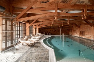 Indoor pool, open 8:00 AM to 10:00 PM, pool loungers