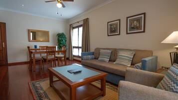 Family Room, 1 Bedroom | Living room | TV