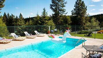 Seasonal outdoor pool, open 9:00 AM to 10:00 PM, sun loungers