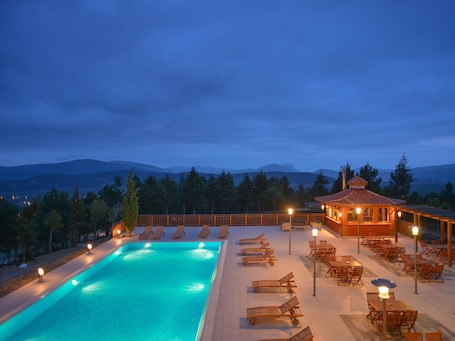 Indoor pool, outdoor pool, pool umbrellas, sun loungers. Sagalassos Lodge & Spa
