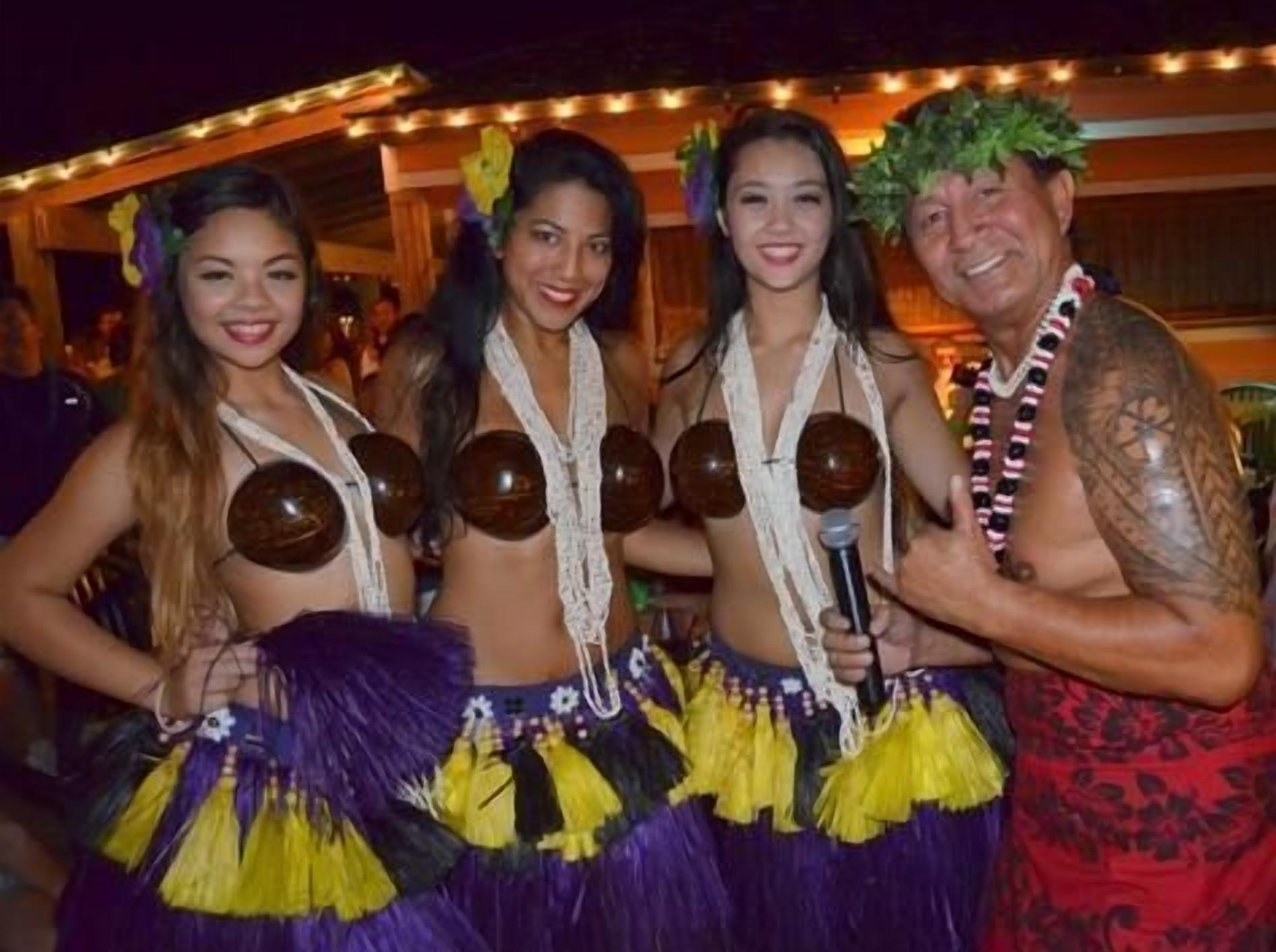 A group of people in festive attire, possibly at a themed event or party.
