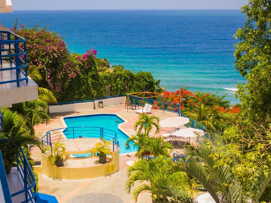 Outdoor pool, a waterfall pool, free cabanas, pool umbrellas