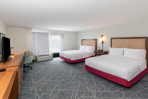 A hotel room with two beds, a desk, a television, and a window with curtains. - Hampton Inn & Suites by Hilton Lonoke (Lonoke)