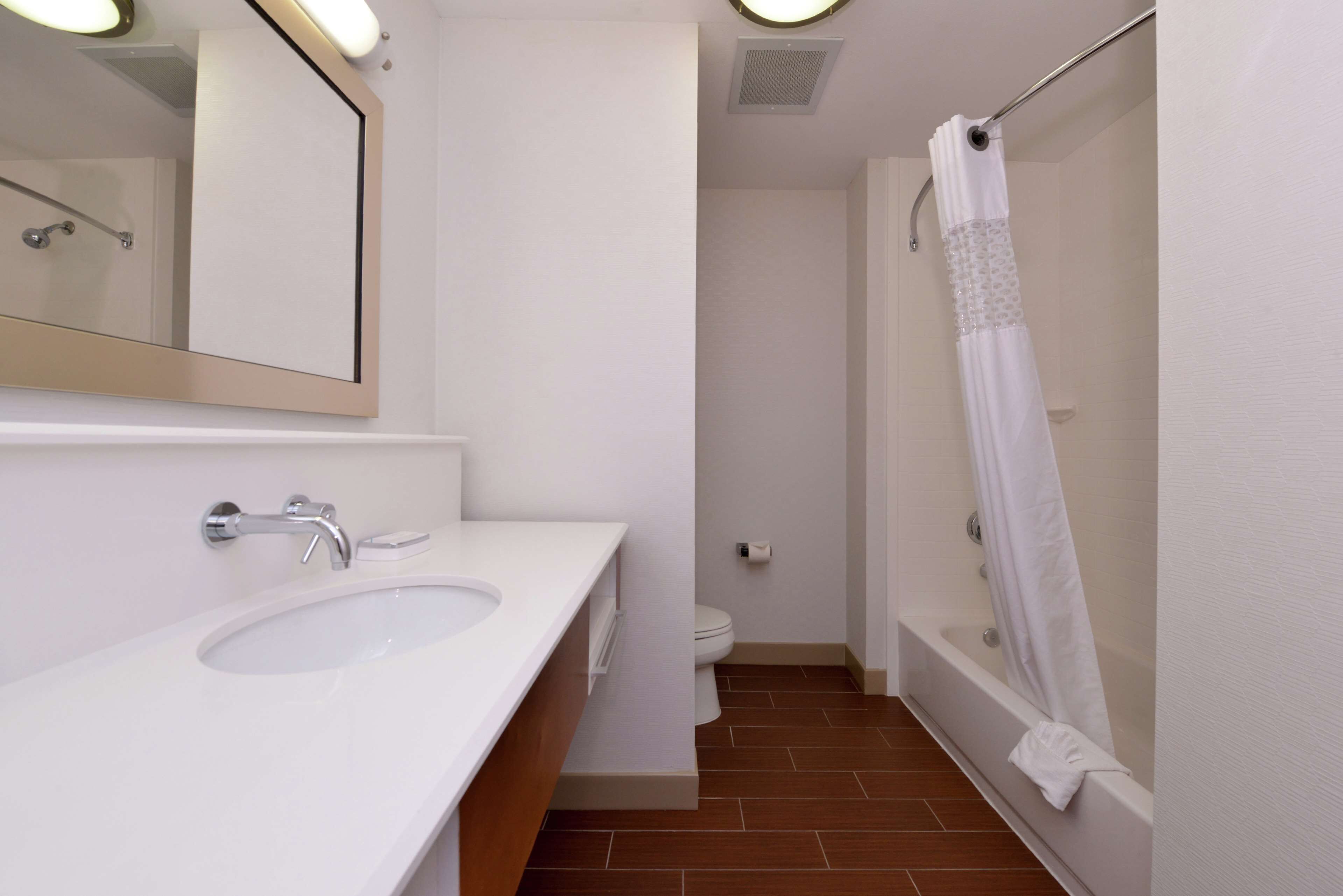 bathtub, bathrobes, towels