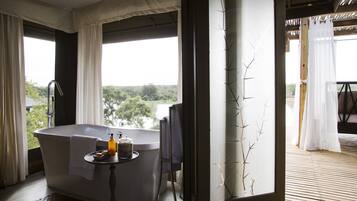 Luxury Tent | Bathroom amenities | Separate tub and shower, eco-friendly toiletries, hair dryer, bathrobes