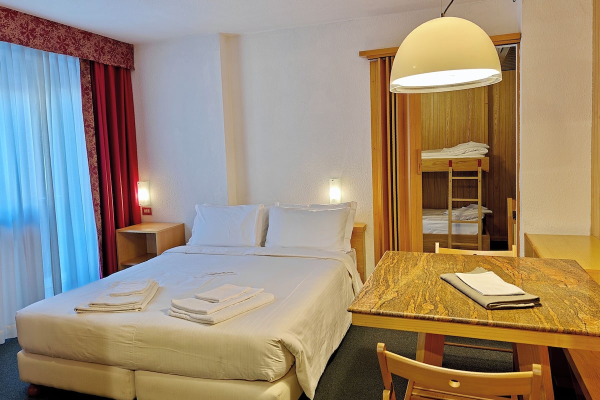 Family Apartment | Living area | 28-inch flat-screen TV with satellite channels
