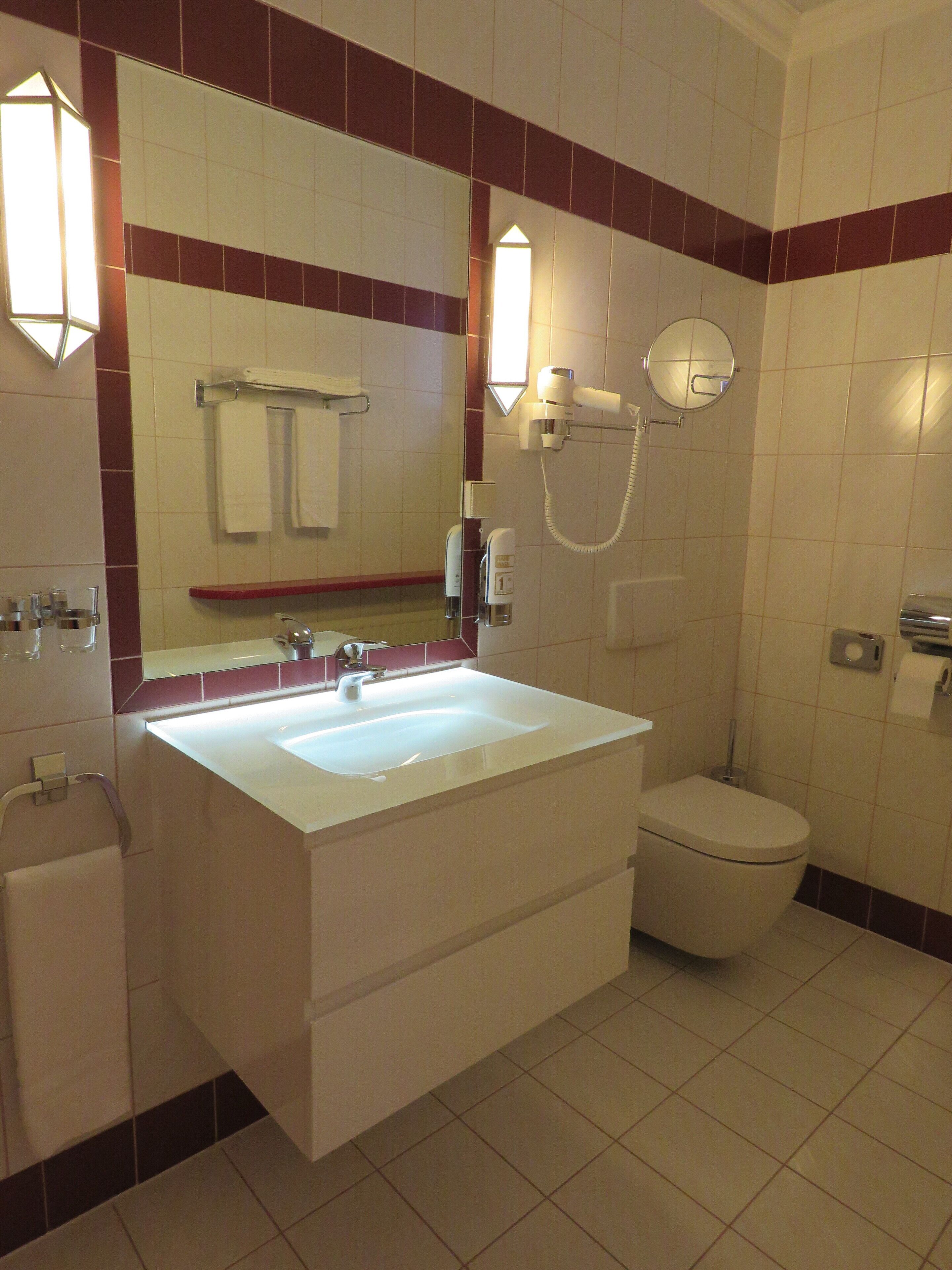 comfort double room, 1 king bed, non smoking, balcony | bathroom | free toiletries, hair dryer, bathrobes, slippers