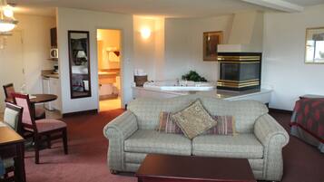 Honeymoon Suite, 1 King Bed with Sofa bed | Living area | Flat-screen TV