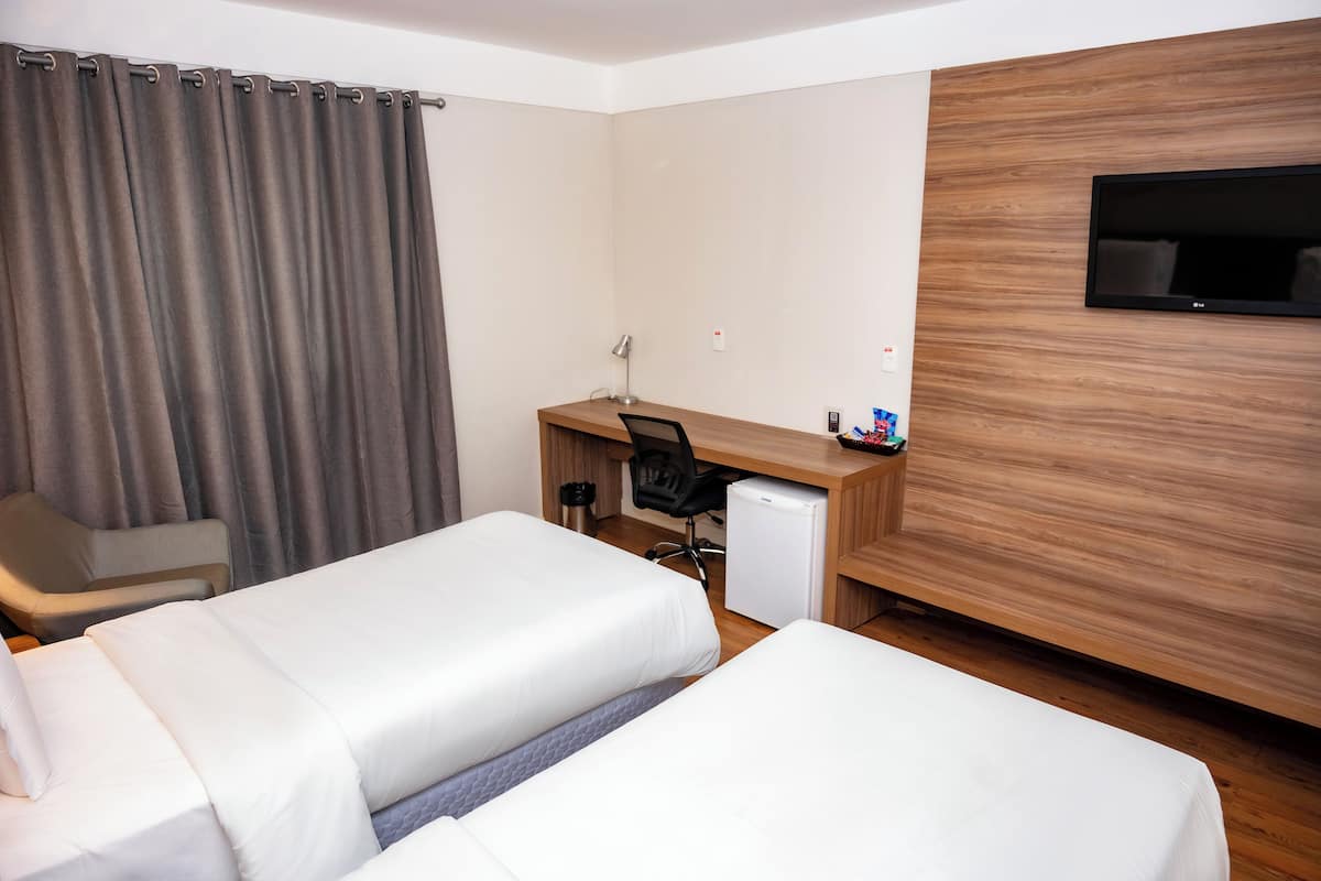 Superior Twin Room | Minibar, in-room safe, desk, laptop workspace