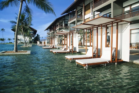 Outdoor pool, pool loungers. Anantaya Resort and Spa Chilaw