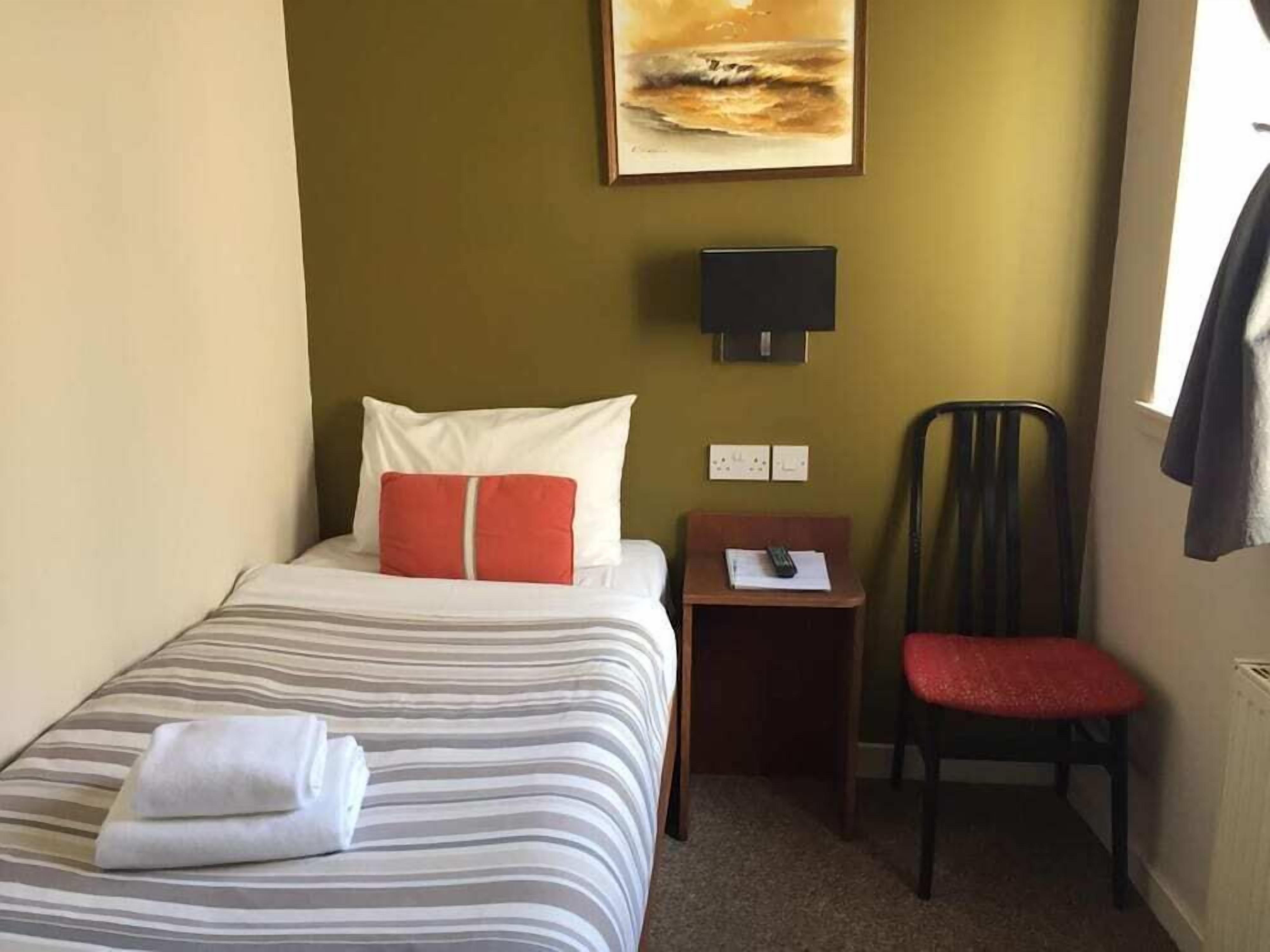 Blackout curtains, iron/ironing board, free WiFi, bed sheets