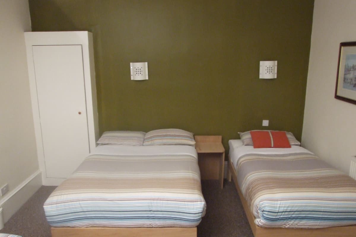 Family Room, Ensuite | Blackout drapes, iron/ironing board, free WiFi, bed sheets