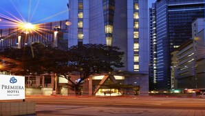 A tall, modern hotel building with a distinctive chevron pattern on its facade, illuminated by interior lights. - Premiera Hotel Kuala Lumpur (Kuala Lumpur)