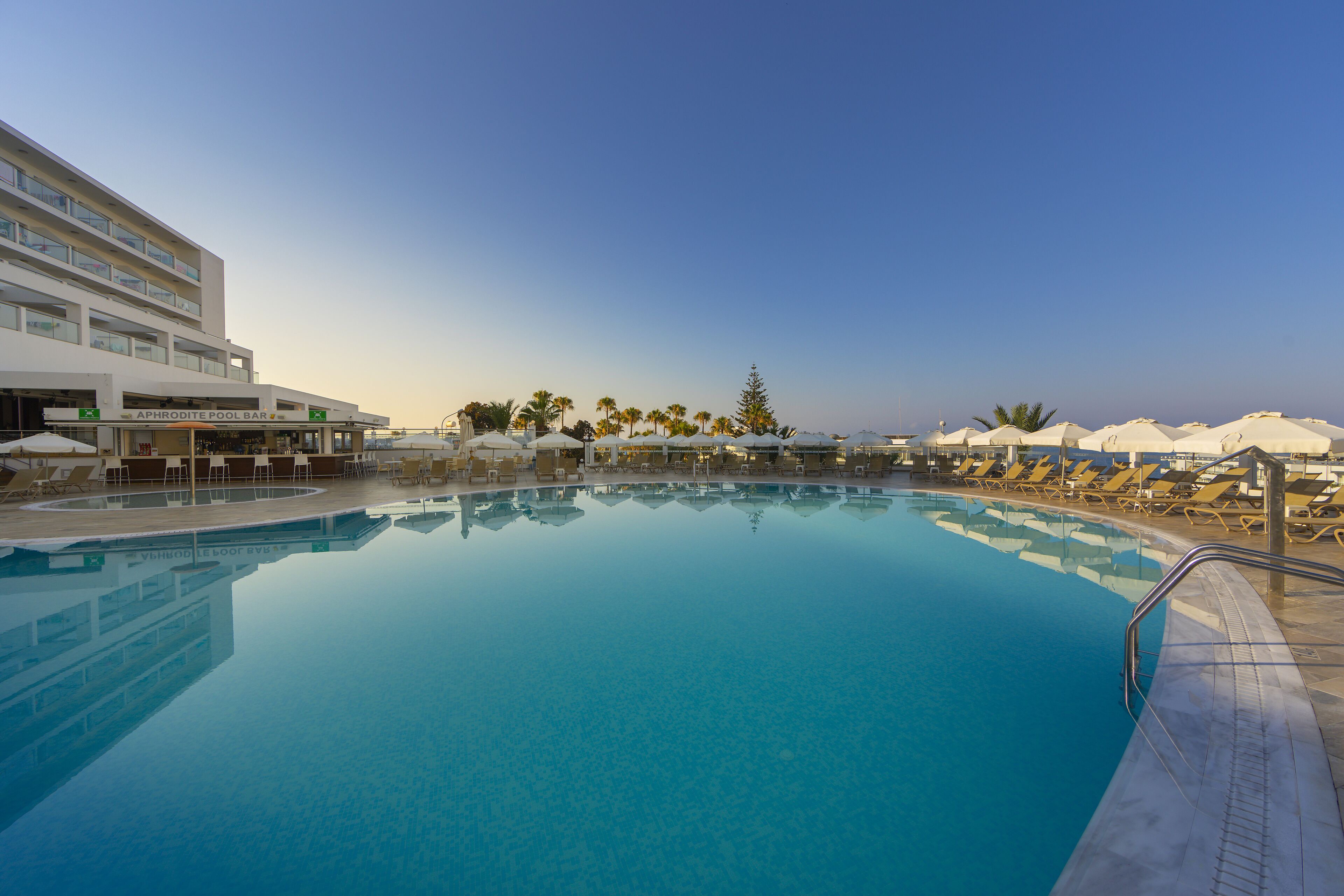 indoor pool, seasonal outdoor pool, pool umbrellas, pool loungers