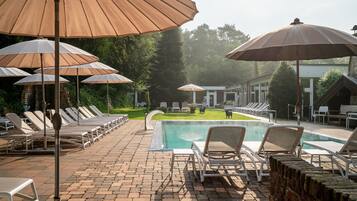 Indoor pool, outdoor pool, pool umbrellas, pool loungers