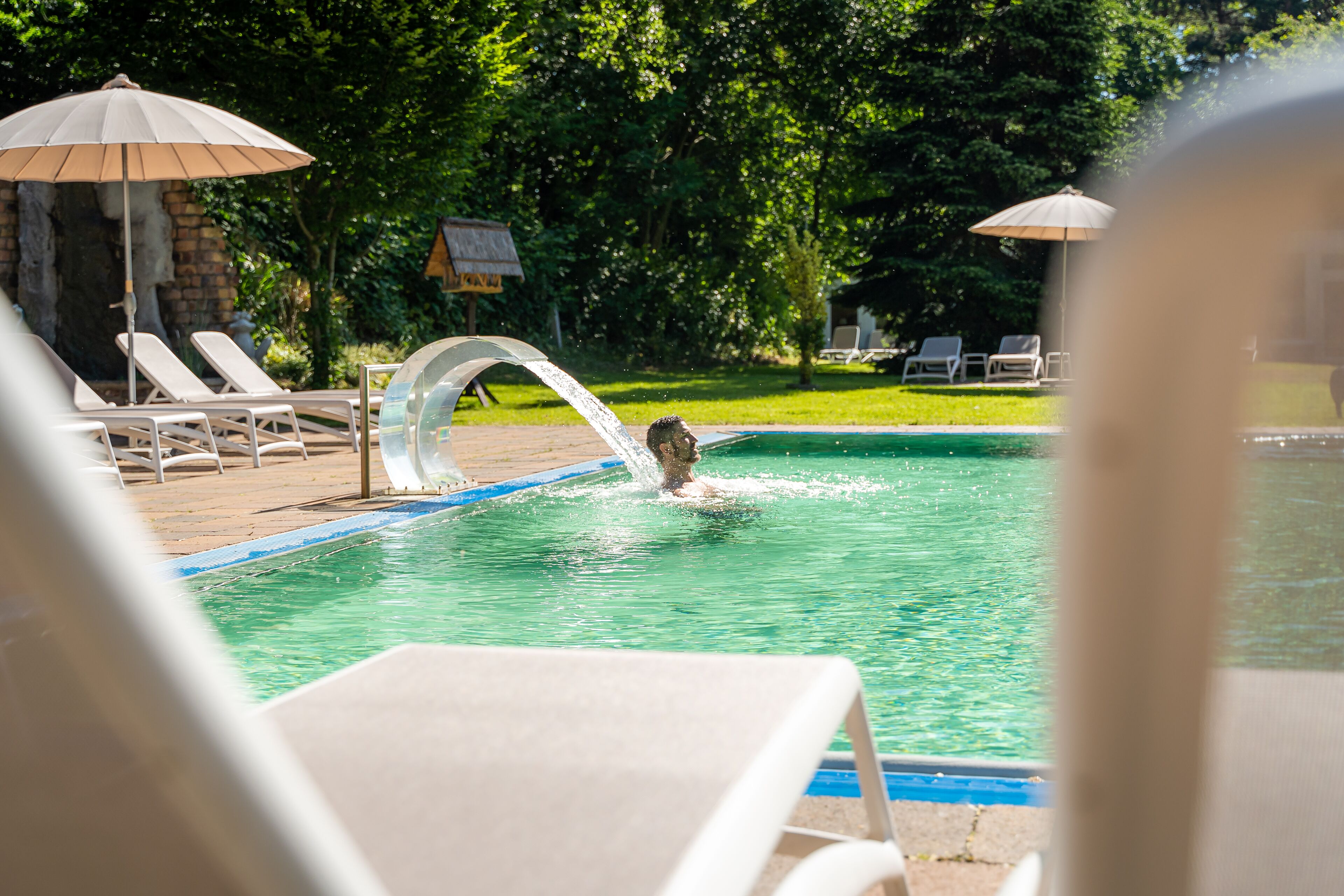 indoor pool, outdoor pool, pool umbrellas, pool loungers