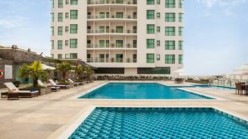 Outdoor pool, pool umbrellas, pool loungers