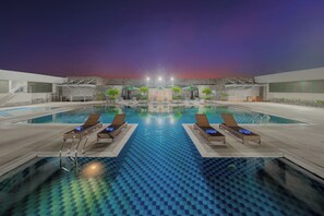Outdoor pool, pool umbrellas, sun loungers