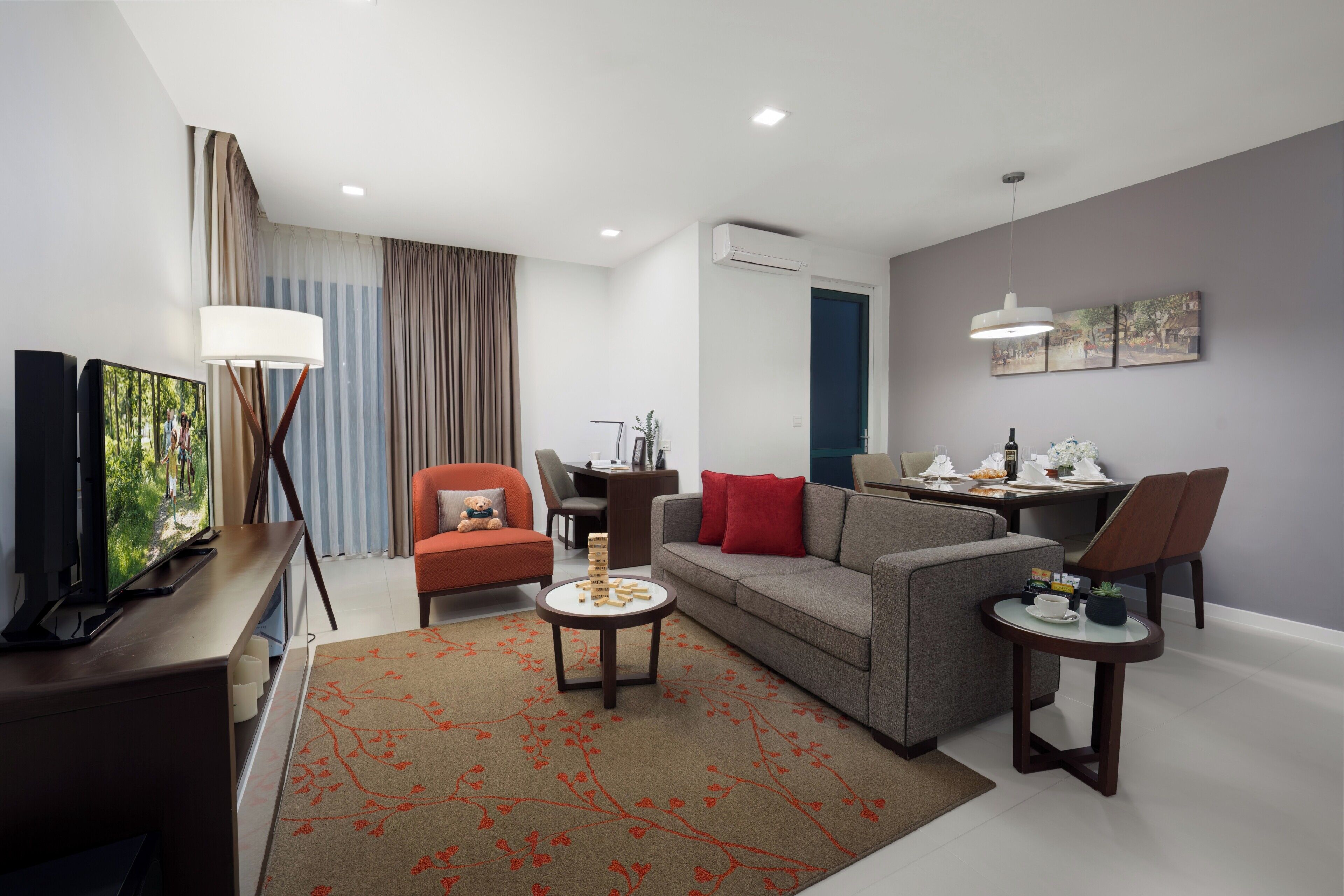 Deluxe Room, 2 Bedrooms, City View | Living area | LCD TV, fireplace, DVD player