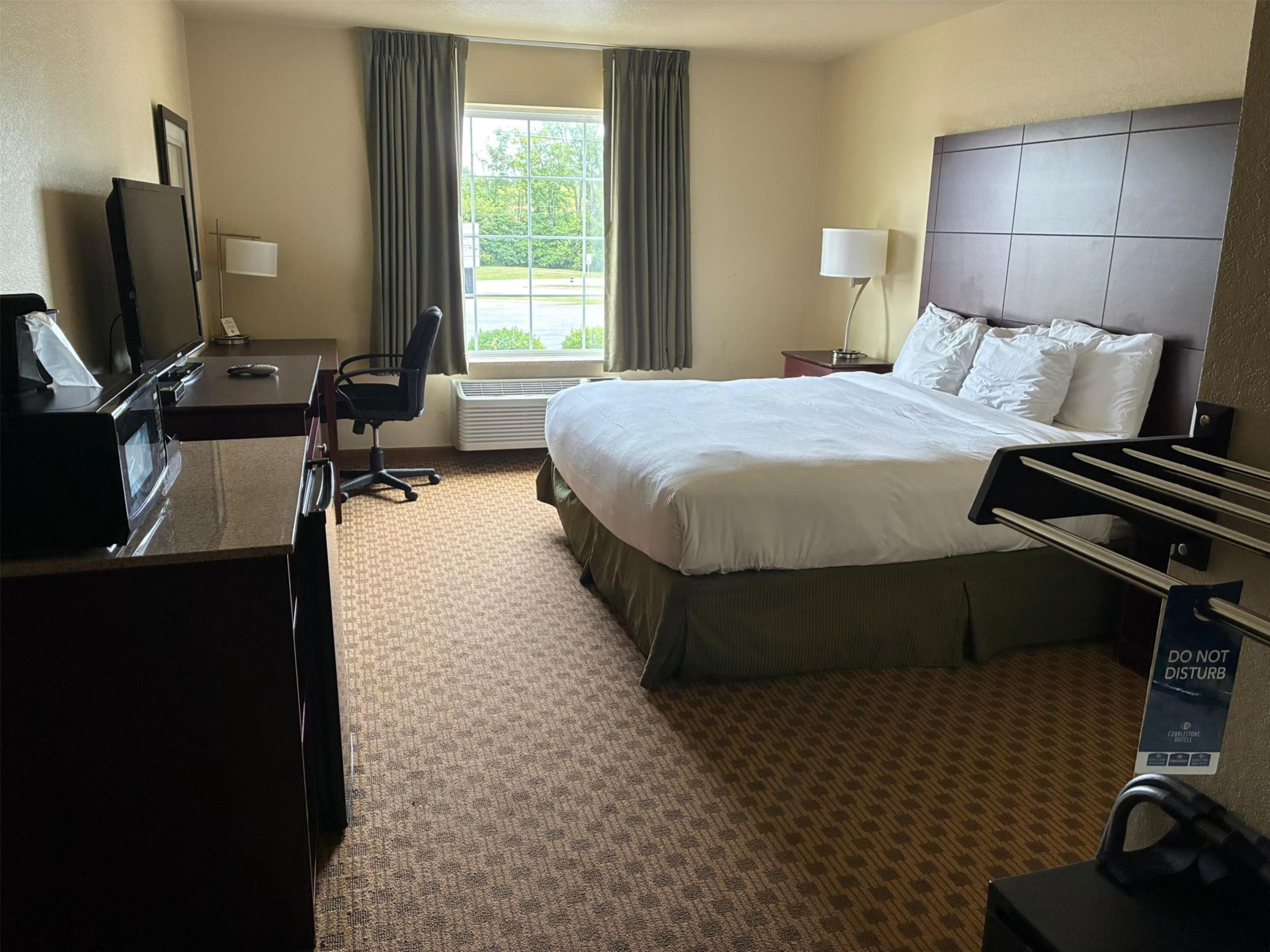 Premium bedding, desk, laptop workspace, blackout curtains