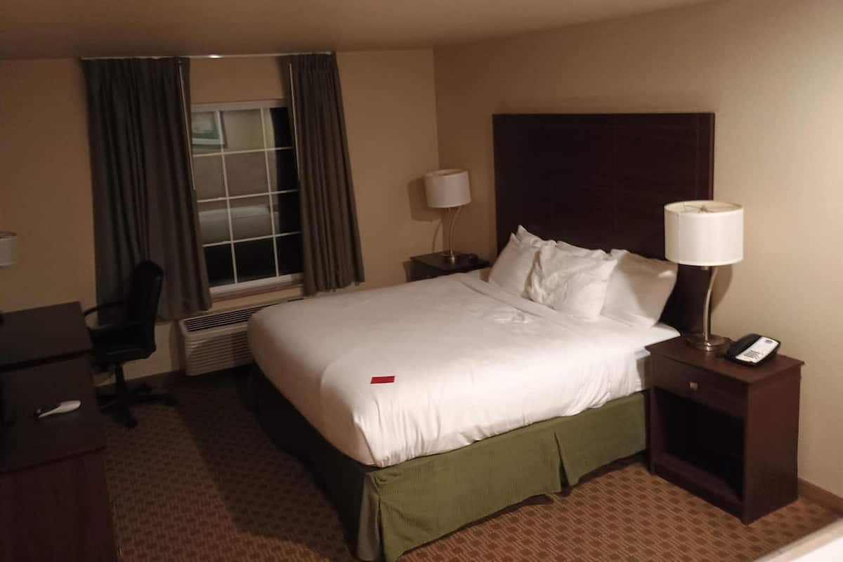 Premium bedding, desk, laptop workspace, blackout curtains