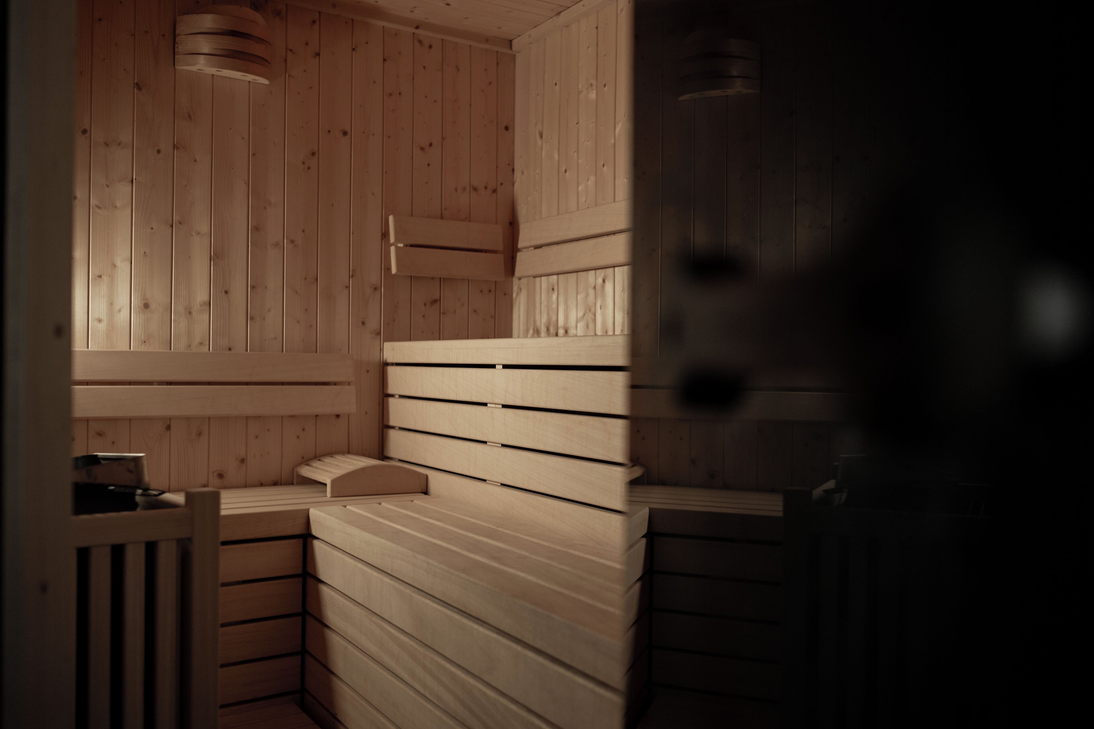 A sauna with wooden walls and benches.
