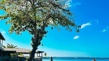 Private beach, white sand, beach shuttle, beach cabanas